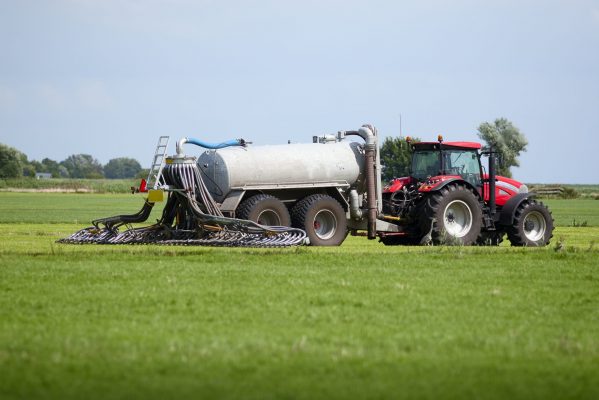 tractor with tank that can directly inject liquid manure into the ground for optimum nutrient placement and odor control